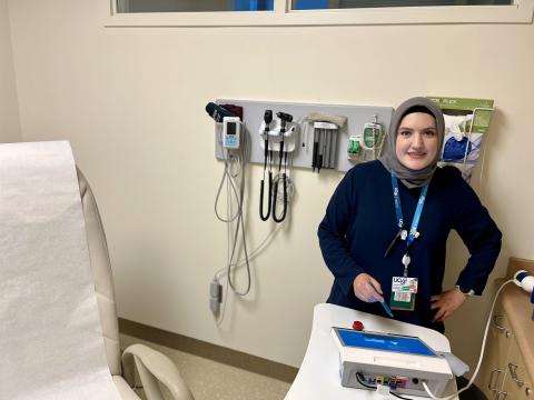 A clinical research coordinator calibrates a spirometry machine