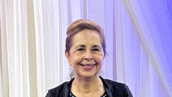 Katherine A. Flores holds her Lifetime Achievement Award