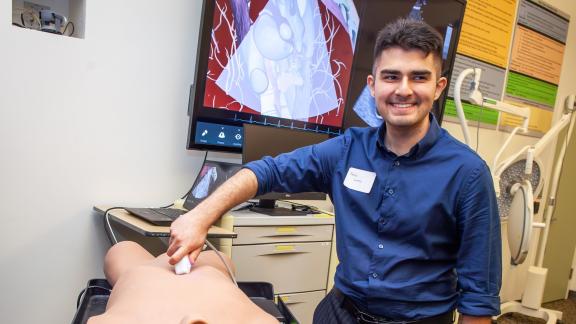 Student learns to use ultrasound