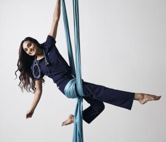 Ranjita Raghavan performing aerial acrobatics in scrubs