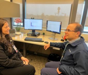 Two people sitting and talking 