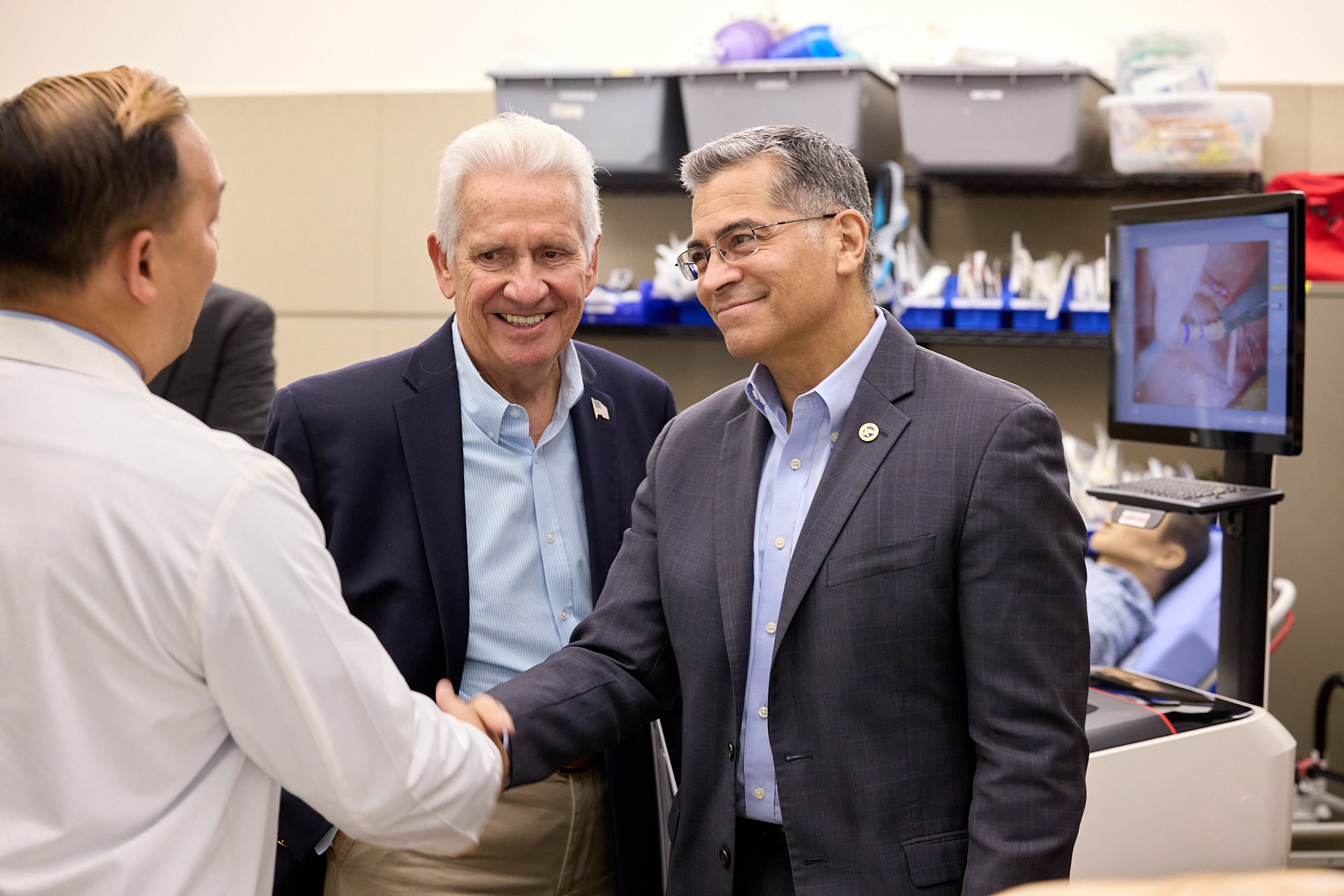 Dr. Kenny Banh greeting U.S. Health and Human Services Secretary Xavier Becerra and Rep. Jim Costa.