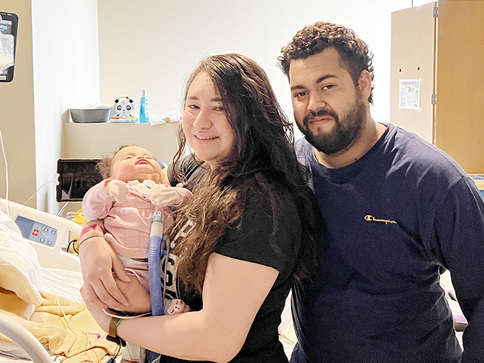 Jazmin and Phillip Walker and daughter, Aurora.