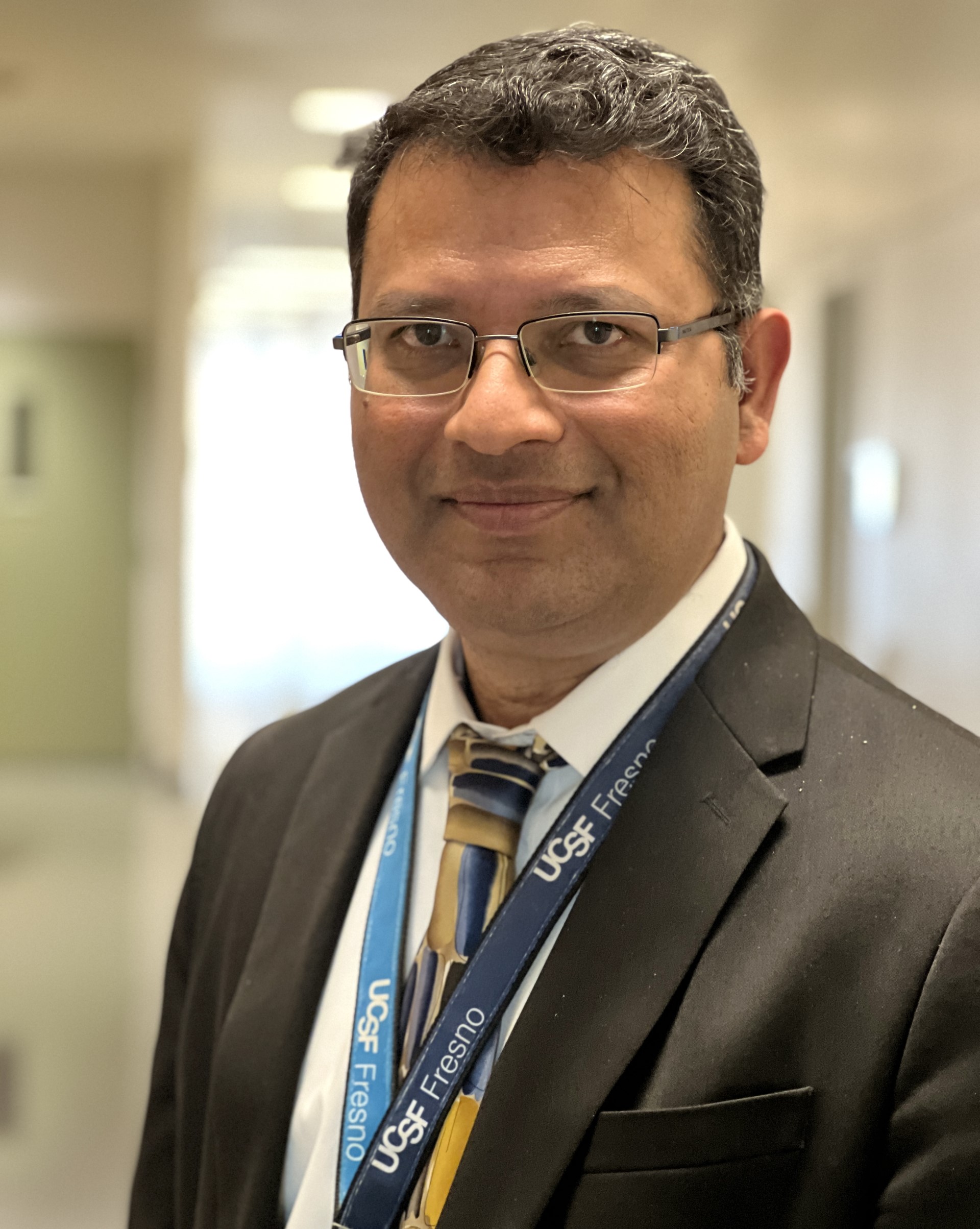 Photo of Dr. Vipul Jain in a suit.
