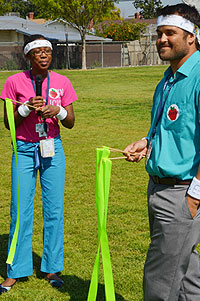 Two ped resdients teaching excercises to kids